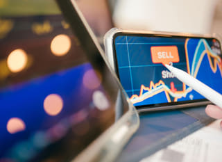Trader examining Bitcoin Ethereum and foreign exchange options across multiple markets
