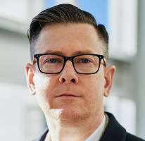 Executive officer Alexander Hughes leading crypto trading firm shown in company portrait
